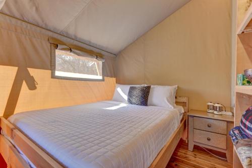 a bedroom with a bed in a tent at 12 Fires Luxury Glamping with AC #1 in Johnson City