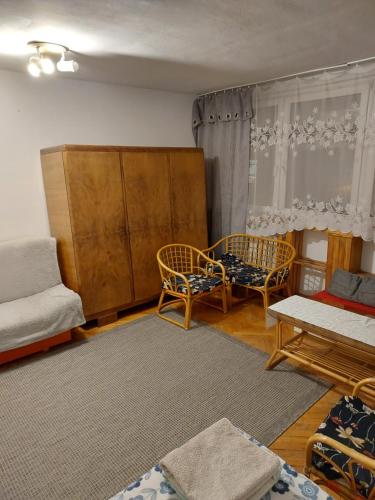 a living room with two chairs and a couch at Однокімнатна квартира Варшава in Warsaw