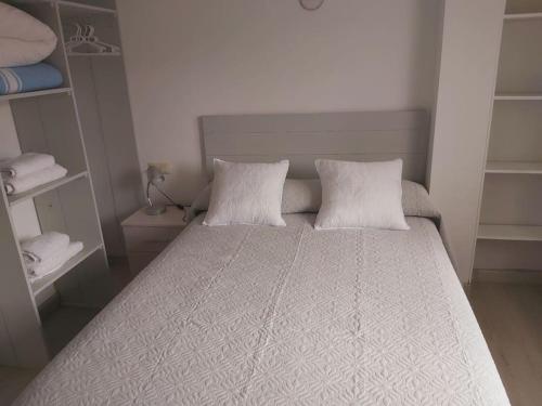 En eller flere senge i et værelse på Novama