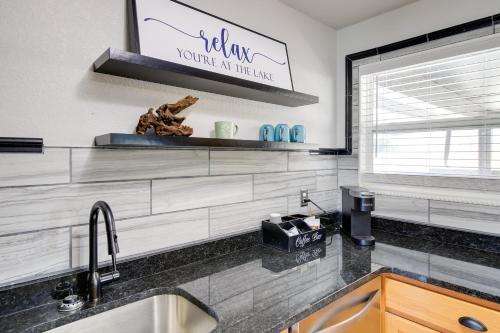 a kitchen with a sink and a counter top at Waterfront Kingston Apartment with River Access! in Kingston