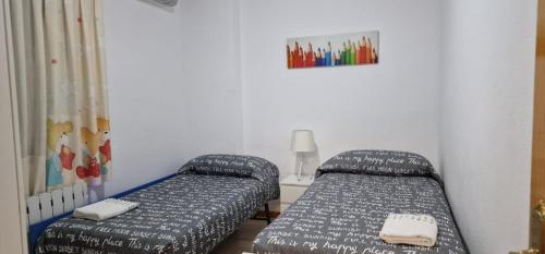 Postel nebo postele na pokoji v ubytování PISO CANAL