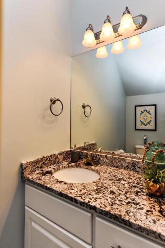 a bathroom with a sink and a mirror at Desert Cool in Ivins