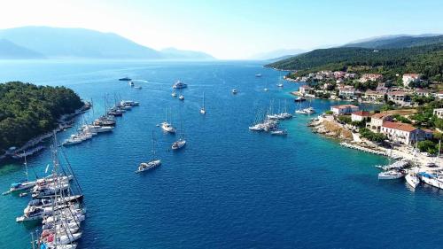 an aerial view of a harbor with boats in the water at Pithari Stone Villa in Fiskardho
