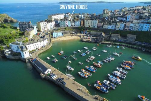 an aerial view of a harbor with boats in the water at Gwynne House - 6 Bed Holiday Home - Tenby Harbour in Tenby