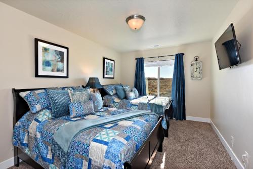 a bedroom with two beds and a window at Desert Dream in St. George