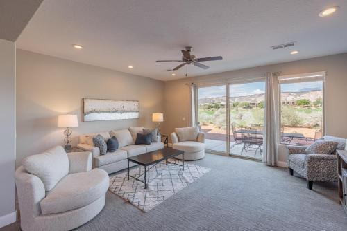 a living room with a couch and chairs and a table at 18th Fairway to Heaven in St. George