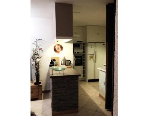 a kitchen with a counter top in a room at R&eacute;sidence Le Galibier 3 66910 in Les Deux Alpes
