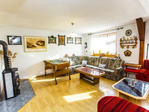 a living room with a couch and a table at Holiday Home Křečovice by Interhome in Rovensko pod Troskami