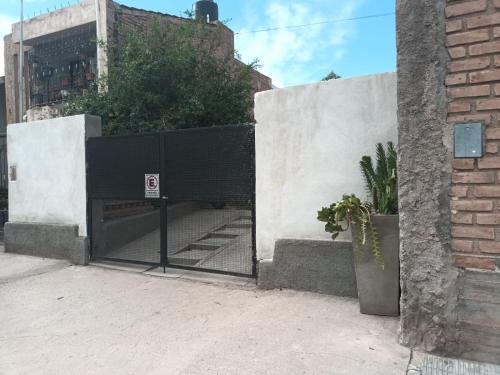 a gate with a no entry sign in front of a building at Wasi in Belén