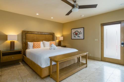 a bedroom with a large bed and a window at El Noa Noa in Palm Springs