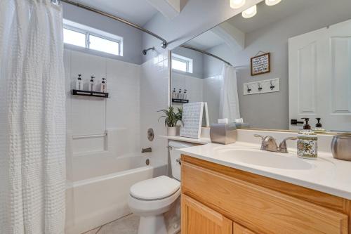 a bathroom with a sink and a toilet and a shower at Inviting Home with Lake View 2 Mi to Lake Havasu! in Lake Havasu City