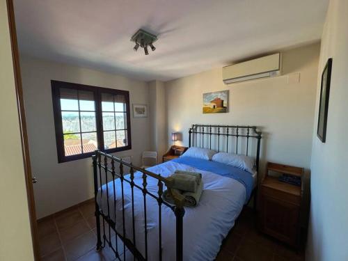 Llit o llits en una habitació de Oasis en Riba Roja del Turia