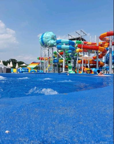 a water park with a colorful water slide at Nektar 88 in Vrnjačka Banja