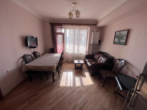 a living room with a couch and a table at Glendel hilz in Yerevan