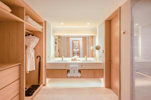 a bathroom with a sink and a mirror at Sunrise Miches Beach Resort, Punta Cana - All Inclusive - Adults Only in Punta Cana