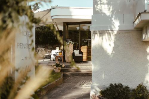 a view of a house with a patio at Hotel Villa Freiheim in Merano