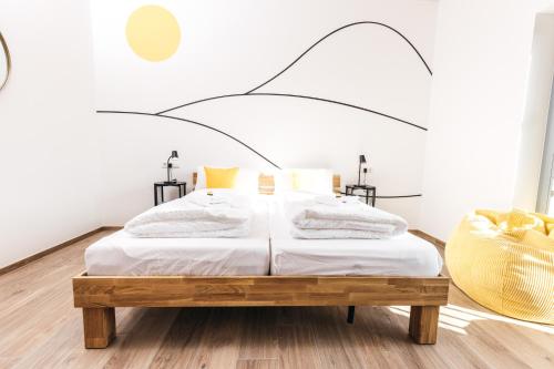 Postel nebo postele na pokoji v ubytování HEIMATEL - Ferienappartements Hochberg