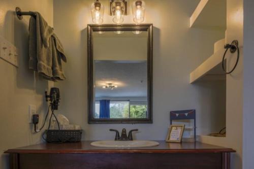 a bathroom with a sink and a mirror at Bells Marina & Fishing Resort - Santee Lake Marion by I95 - Family Adventure, Pets on Request! in Eutawville