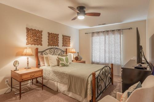 a bedroom with a bed and a ceiling fan at Hoodoo Haute in St. George
