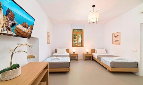 Postel nebo postele na pokoji v ubytování Sun Stone Villas