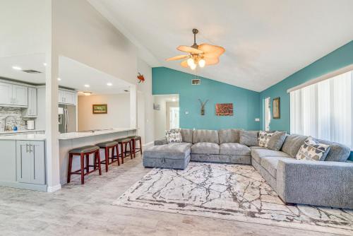 a living room with a couch and a kitchen at Private Dock Riverfront Homosassa Home! in Homosassa