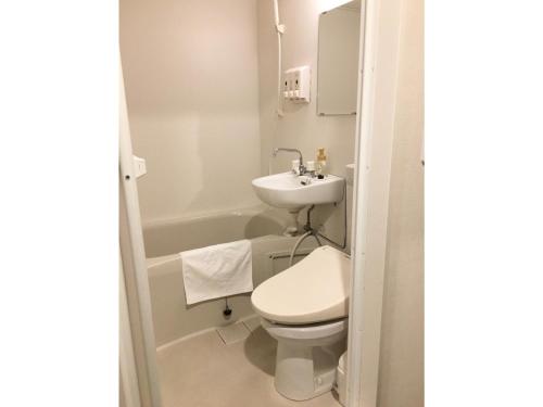 a bathroom with a toilet and a sink at Fujisan Resort Hotel - Vacation STAY 57971v in Fujikawaguchiko