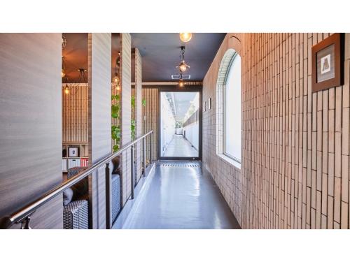 a hallway of a building with a long hallway at River Side Arashiyama - Vacation STAY 86277v in Kyoto