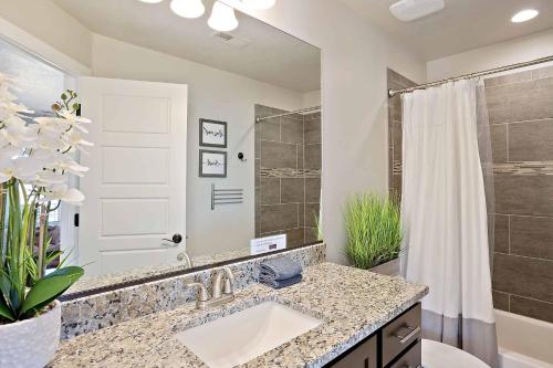 a bathroom with a sink and a shower at Desert Haven in St. George