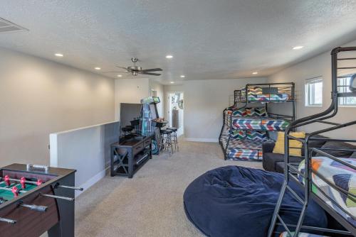 a room with a bedroom with bunk beds and a table at Triple R Getaway in Ivins