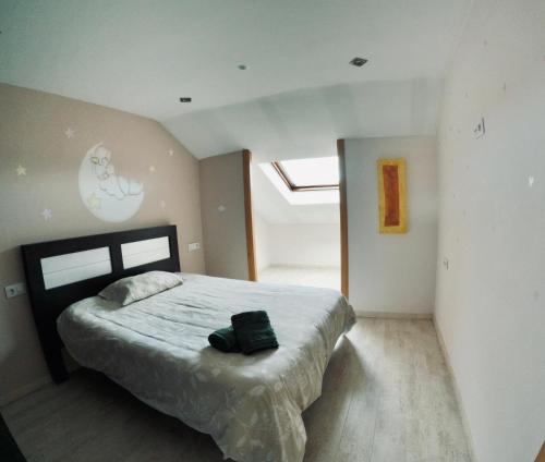 Кровать или кровати в номере Ático os porches