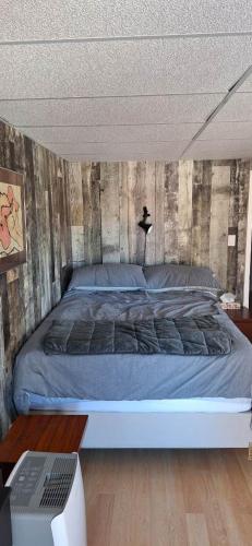 a bedroom with a large bed in a room at Nature Retreat in the city in Ottawa