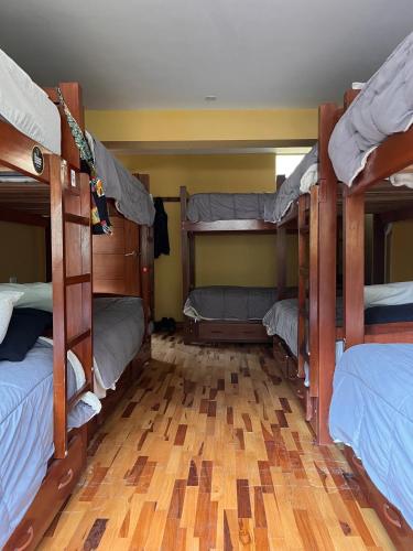 Postel nebo postele na pokoji v ubytování El Parche Rutero Hostel