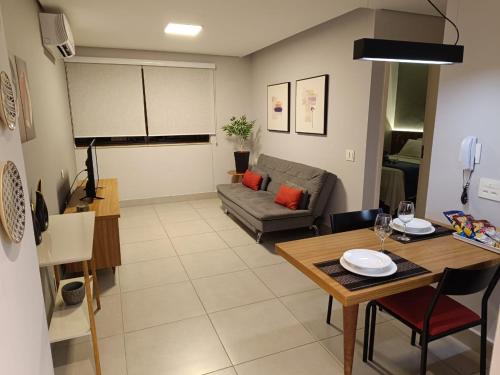 a living room with a couch and a table at Apartamentos & Flats La Residence Paulista in Sao Paulo