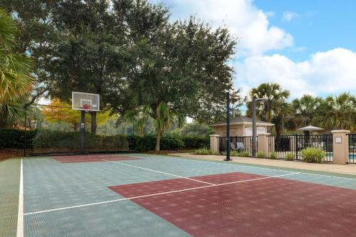 a tennis court with a basketball hoop on it at Staybridge Suites Tallahassee I-10 East by IHG in Tallahassee