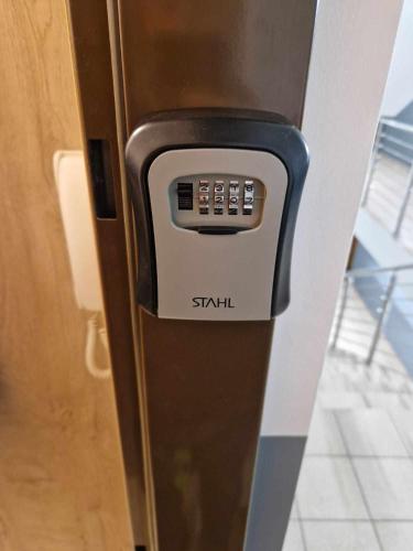 a parking meter on the side of a door at Sądowa 6 in Żory