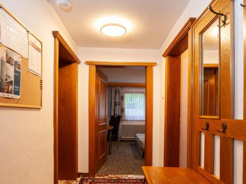 a hallway with a door leading to a room at Apartment Aurora Apartment Top I by Interhome in Kappl
