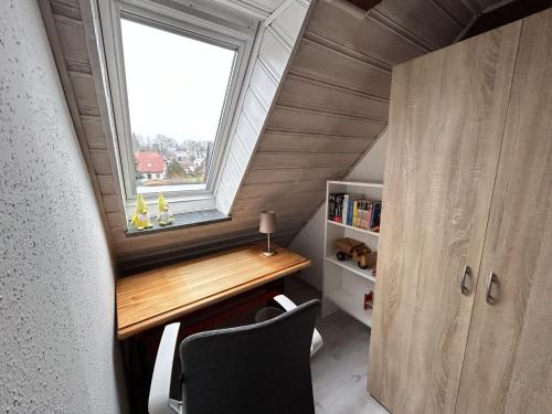a tiny house with a window and a desk at Holiday Home Selma by Interhome in Großschönau