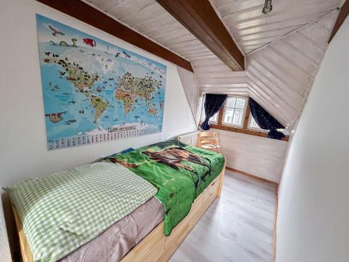 a bedroom with a bed with a map on the wall at Holiday Home Selma by Interhome in Großschönau
