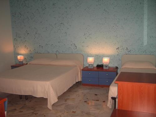 Postelja oz. postelje v sobi nastanitve Etna Inn