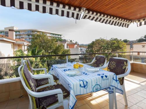 a table and chairs on a balcony with a view at Apartment Venecia-2 by Interhome in Platja  d'Aro