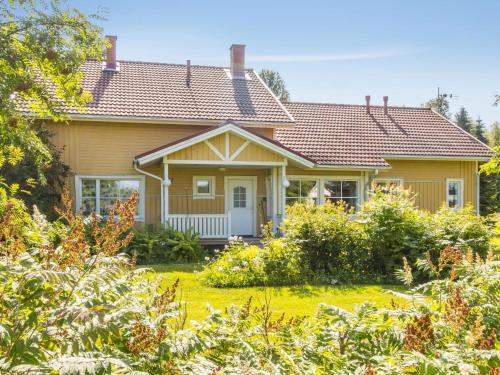 a house with a garden in front of it at Holiday Home Grand villa kemijoki by Interhome in Kupari