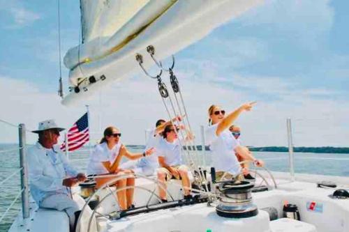 a group of people on a boat on the water at Luxury Getaway! Brand New 4BD! Near Coligny Beach in Hilton Head Island