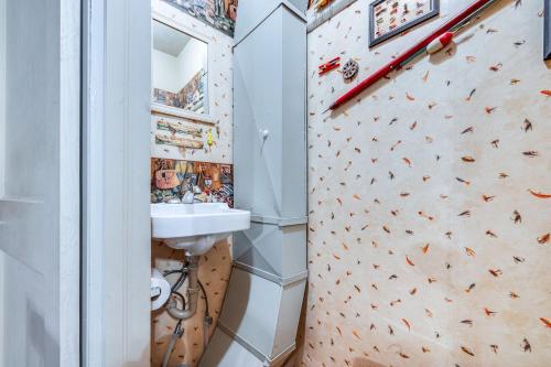 a bathroom with a climbing wall and a sink at Clear Lake Vacation Rental Walk to City Beach! in Clear Lake