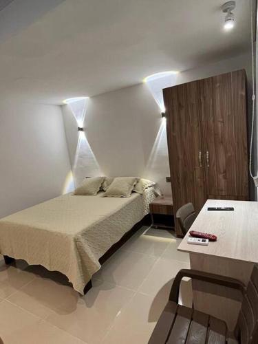 A bed or beds in a room at Apartaestudio 1 en Barranquilla