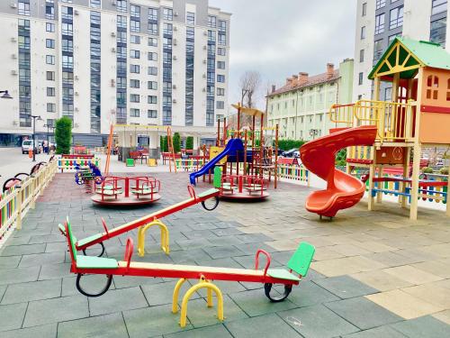 a playground with many different types of play equipment at Apartament lux in Chişinău