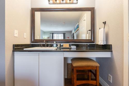 a bathroom with a sink and a mirror at 2BR Walk-In Condo - Near the 76 Strip - Free WIFI - Pool - FREE TICKETS INCLUDED - CLB-3 in Branson