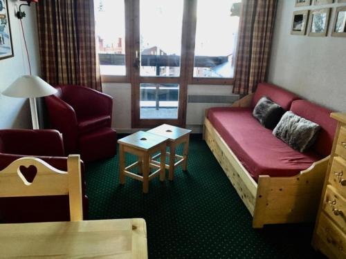 a room with a couch and a chair and a table at Résidence Le Hameau du Sauget - maeva Home - Appartement 2 pièces 6 person 334 in La Plagne Tarentaise