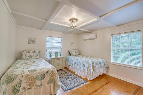 a bedroom with two beds and a window at Quiet Retreat with Boat Parking, 2 Mi to Marina in Inglis