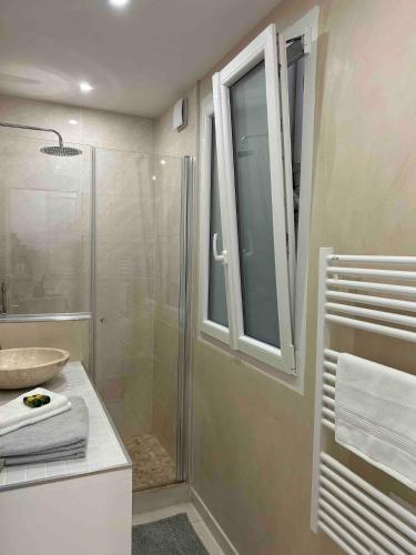 a bathroom with a shower and a sink at Cocooning & Cosy Apartment in Center Paris 17 in Paris