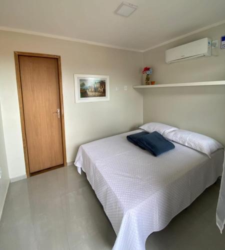מיטה או מיטות בחדר ב-Espaço d Lurdes